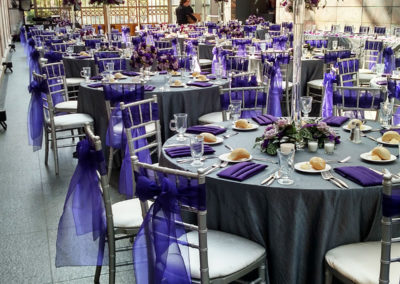 Wedding at Joslyn Art Center with grey linens and purple accents