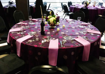 Purple swirl specialty linen on round table