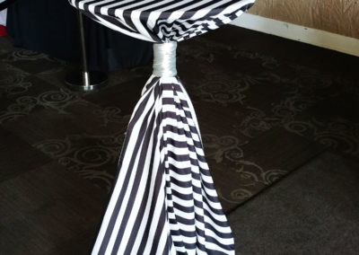 Striped cocktail table tied with white ribbon