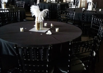 All black linen on round tables with black chivari chairs
