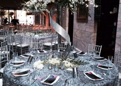 Decadent silver metallic table setting with silver chivari chairs