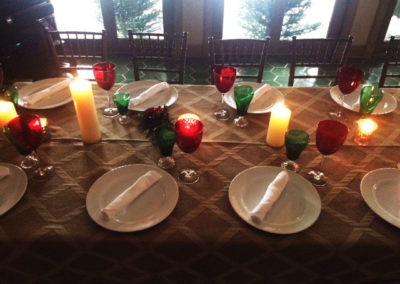 Neutral specialty linen with red and green glasses on banquet table