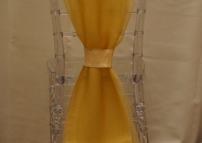 Acrylic chivari chairs with yellow ribbon