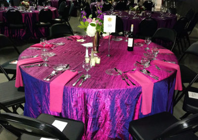 Purple iridescent specialty linen on round table