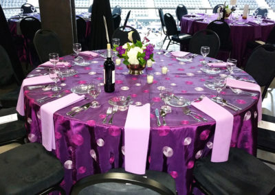 Purple swirl specialty linen on round table