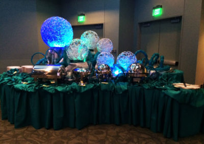 Blue wicker lighting with serpentine tables