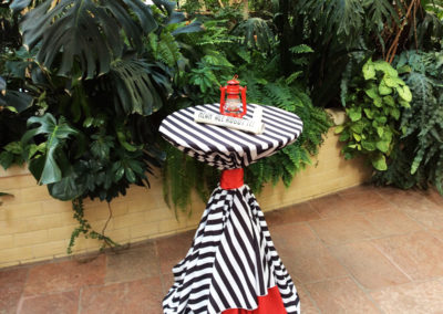 Striped cocktail table tied with red ribbon