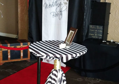 Striped cocktail table tied with gold ribbon